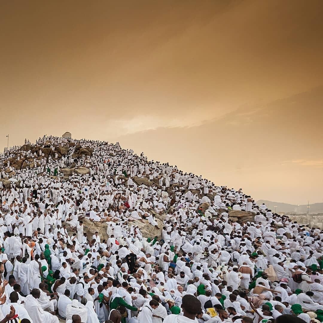 Pilgrims on the plain of Arafah at sunset during Hajj